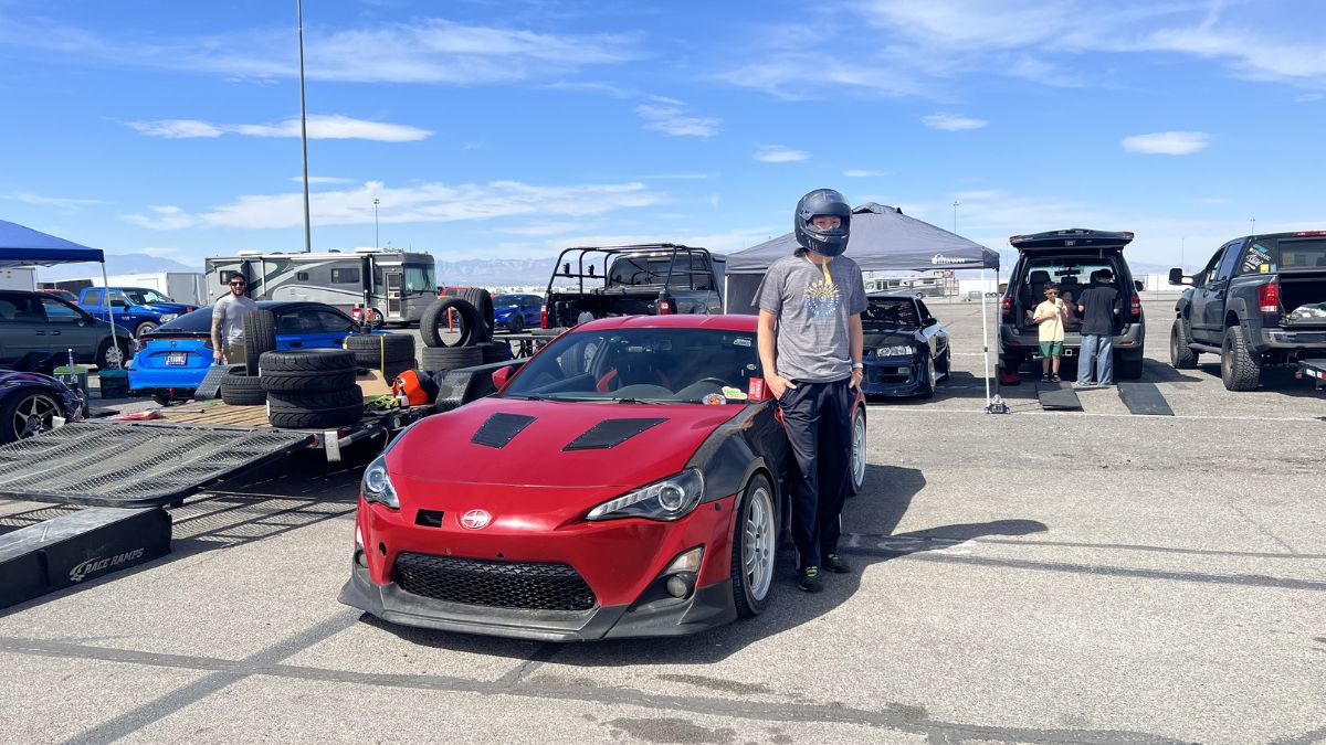 Mykii Liu next to his Scion FR-S at Vegas Drift